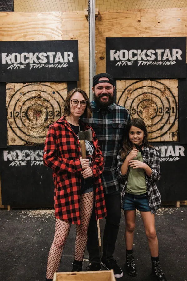 A fun family event featuring axe throwing in an indoor entertainment venue.