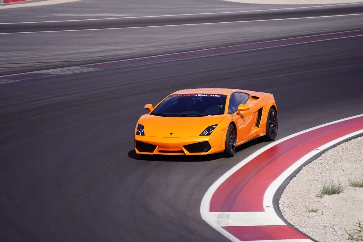 An orange sports car on a race track