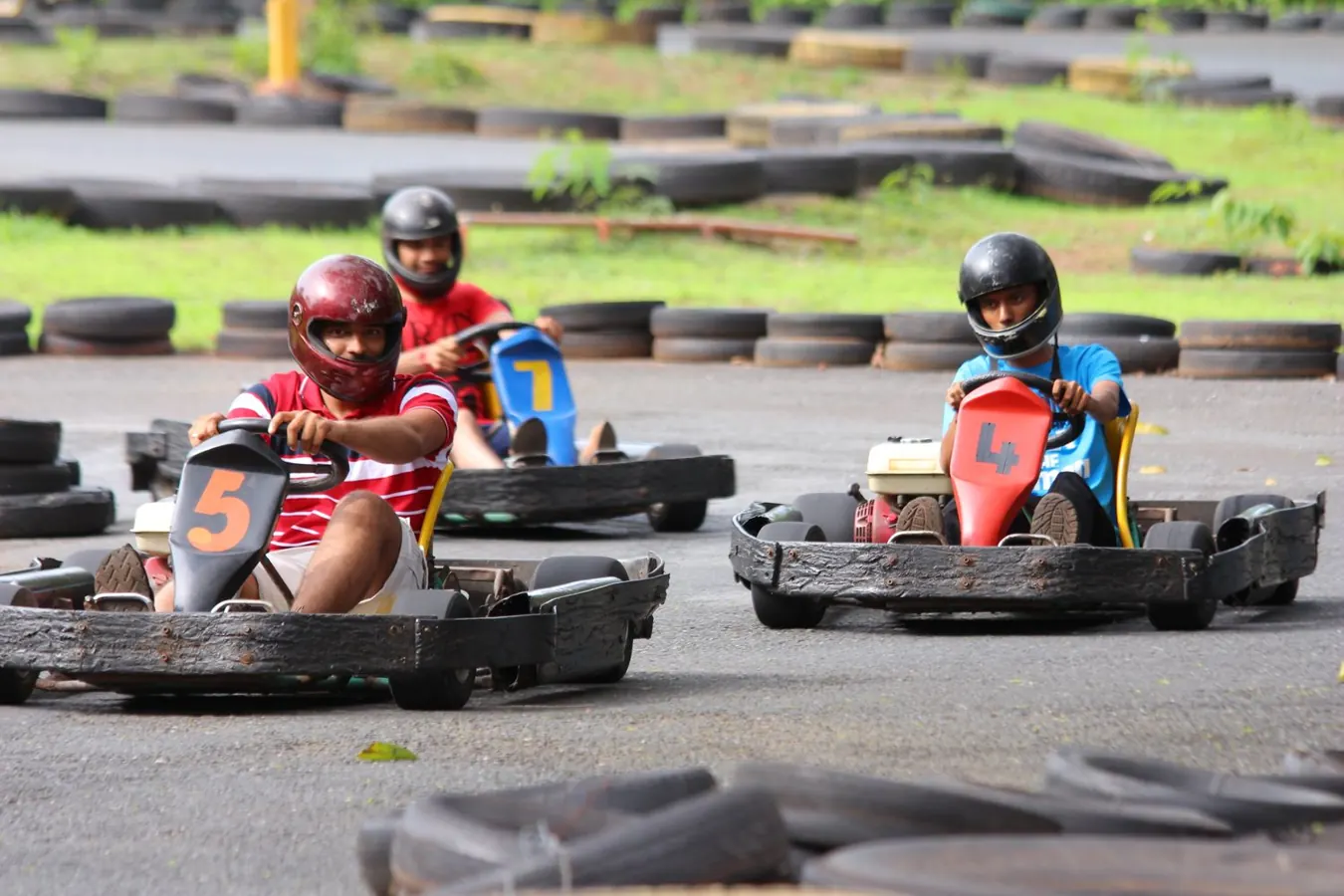 Friends racing go-karts on an outdoor track